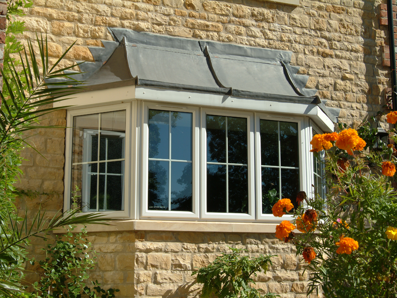 UPVC Bay Window with Flowers in the foreground