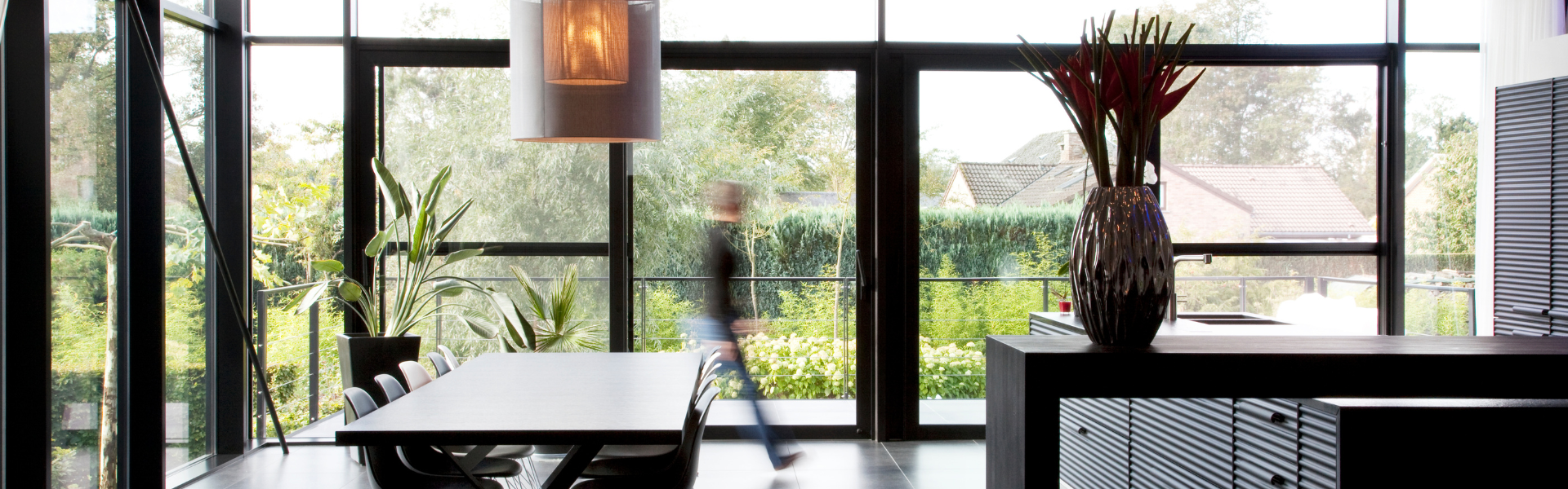 Aluminium doors installed in an open plan kitchen living area.