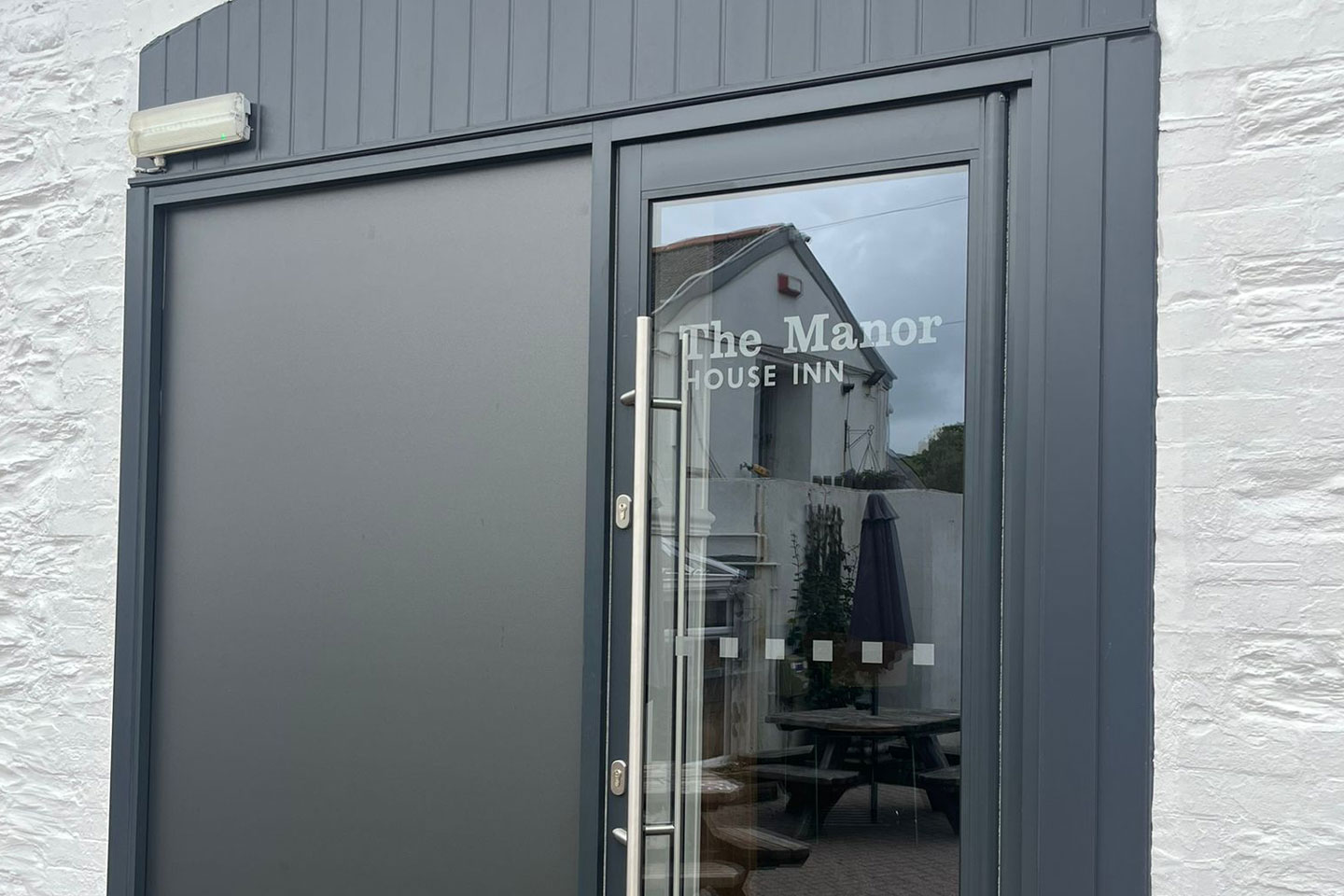 Grey coloured Commercial Door at a Inn in Devon
