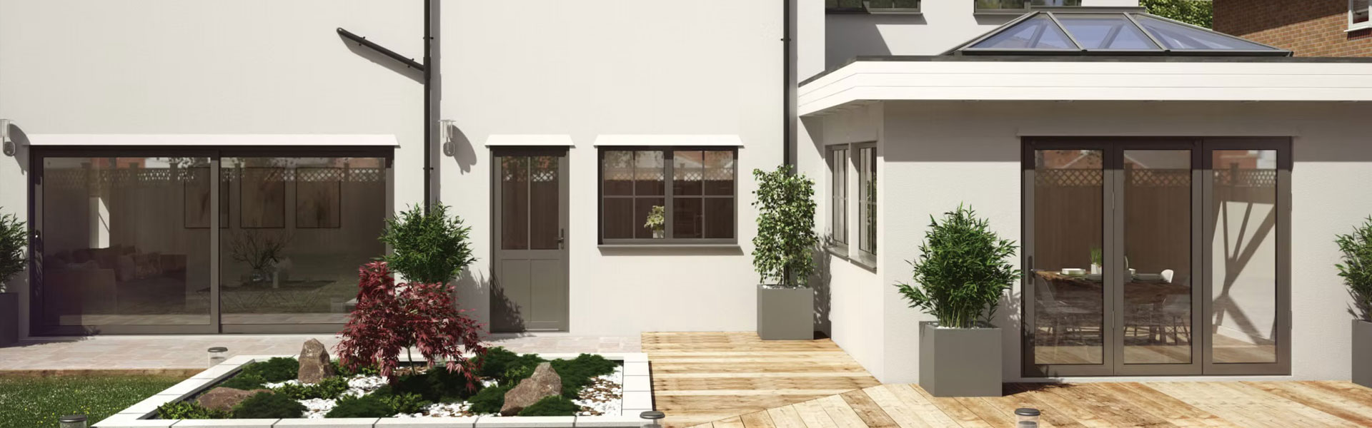 Door and aluminium doors leading out to a decking and paved area