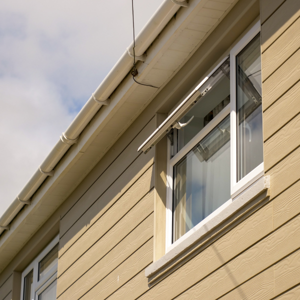Cladded house and roofline with open window