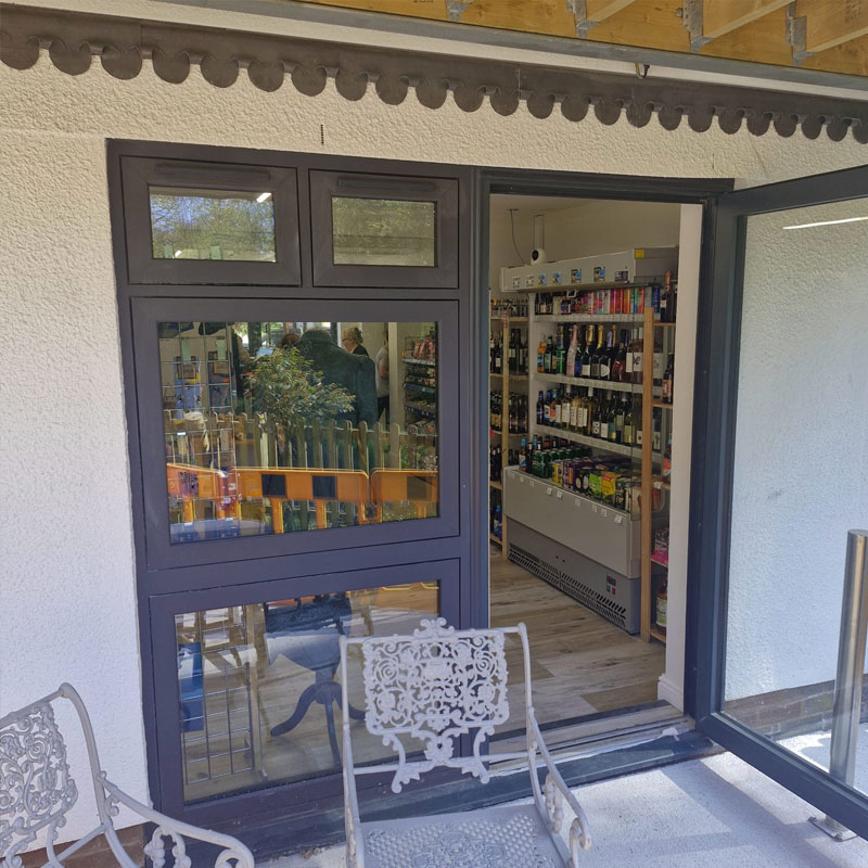 Grey coloured commercial doors fitted to a retail premises