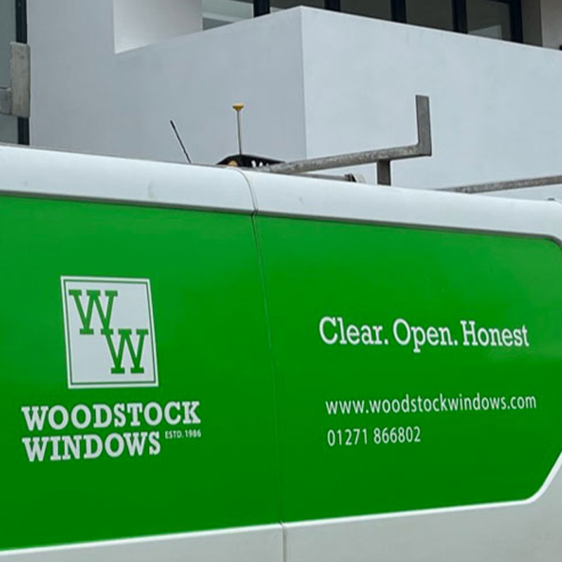Woodstock Windows van on location with contact us details displayed