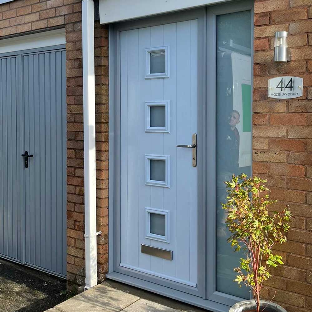 White and grey coloured Endurance Door fitted to a brick built home
