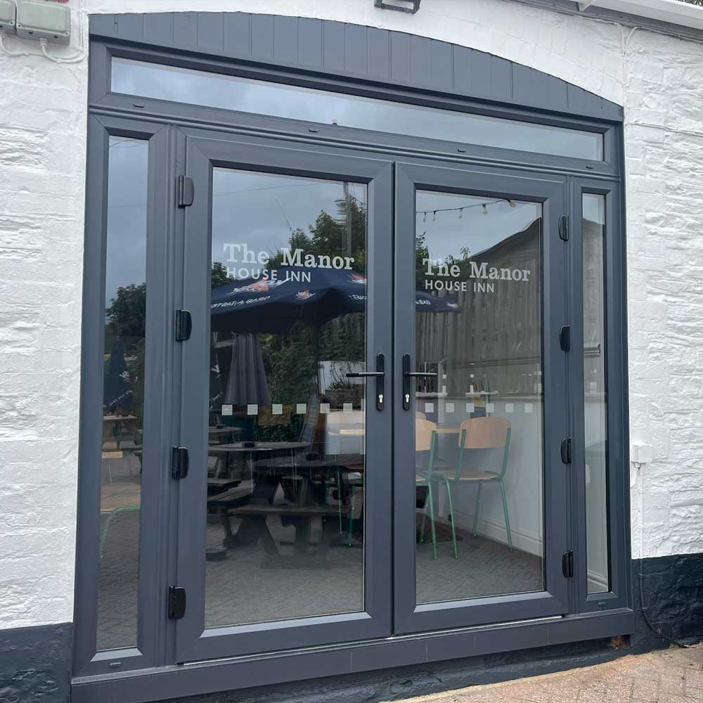 Grey coloured French patio doors fitted to public house