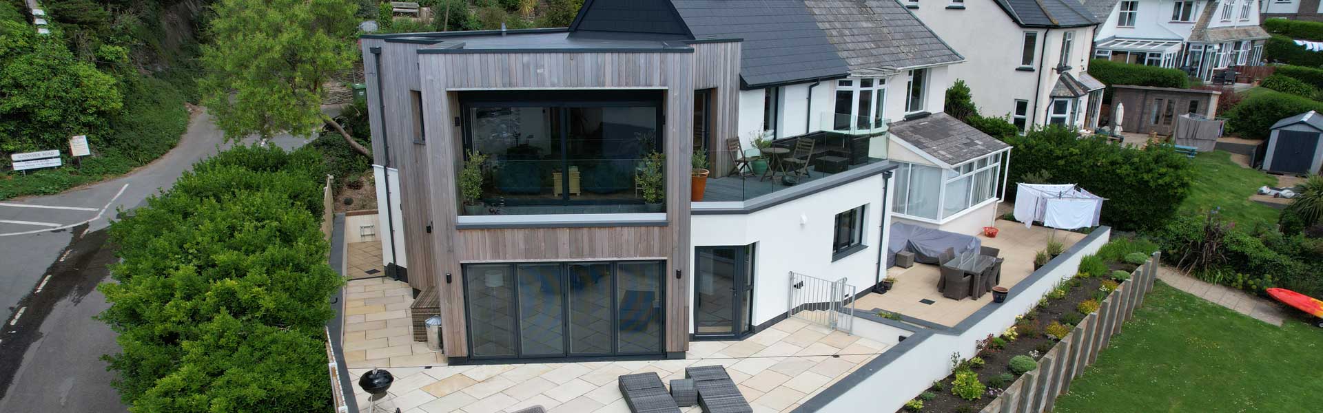 House in Woolacombe with new grey windows fitted & lift & slide patio doors