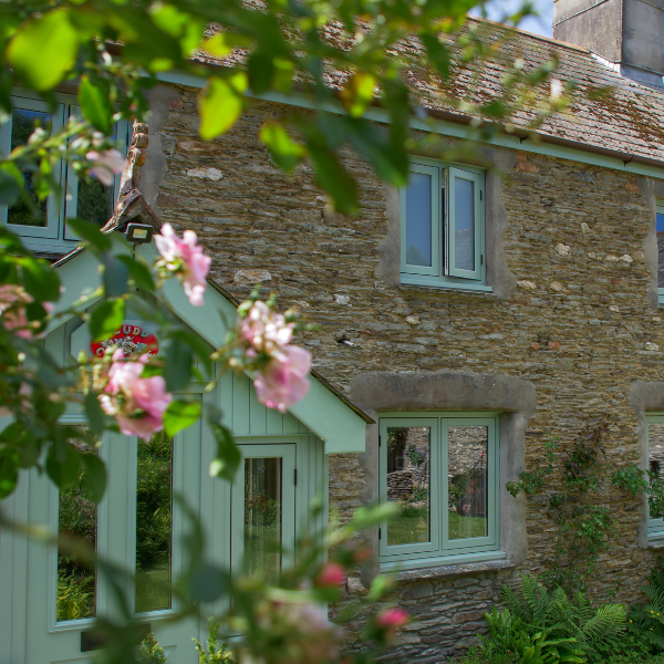 Residence Windows on Stone Cottage in green