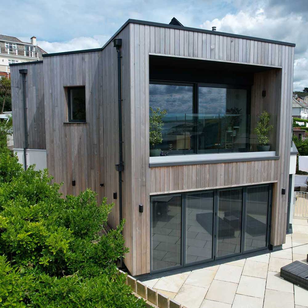 Dark grey coloured Reynaers slimline lift and slide patio doors