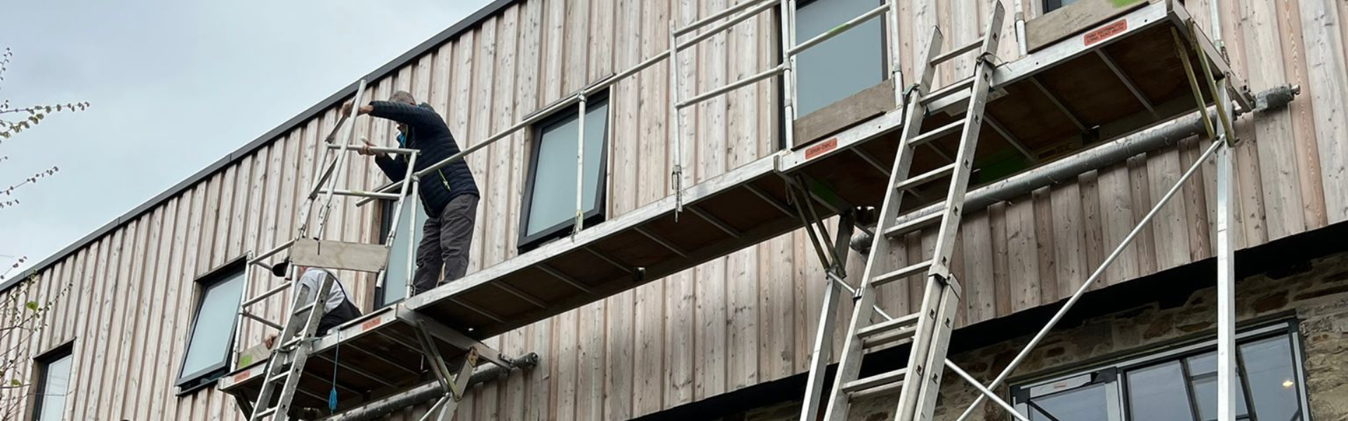 Woodstock Windows staff working on a property on a sacffold tower 