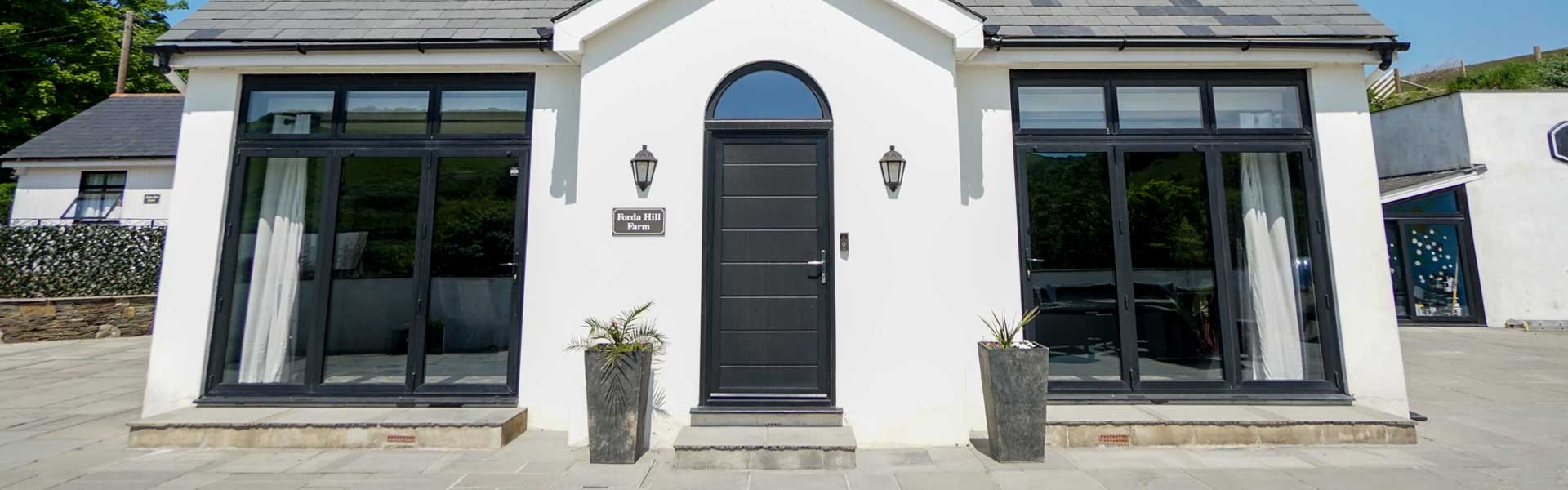 Dark grey Smarts Signature Door at the front of a home