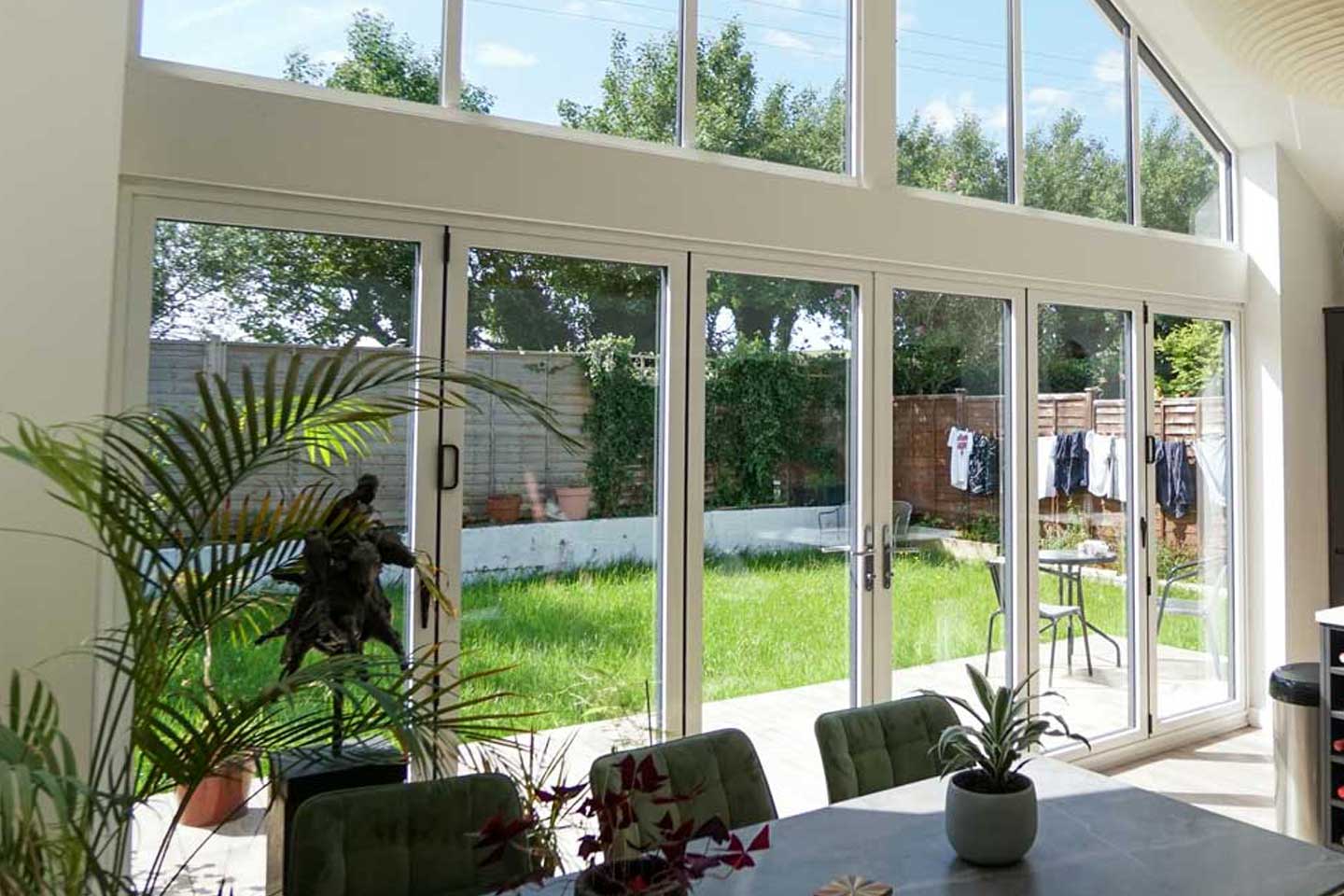 Kitchen and dining area with Visoglide Bi-Fold Doors