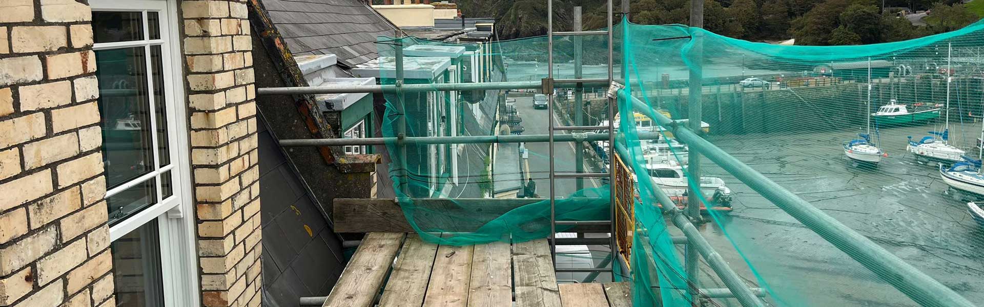 Wooden windows being fitted by the Woodstock Windows team near a harbour