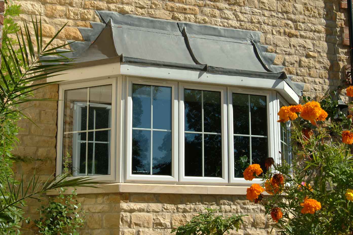 White coloured Bay Window fitted to a stone built home