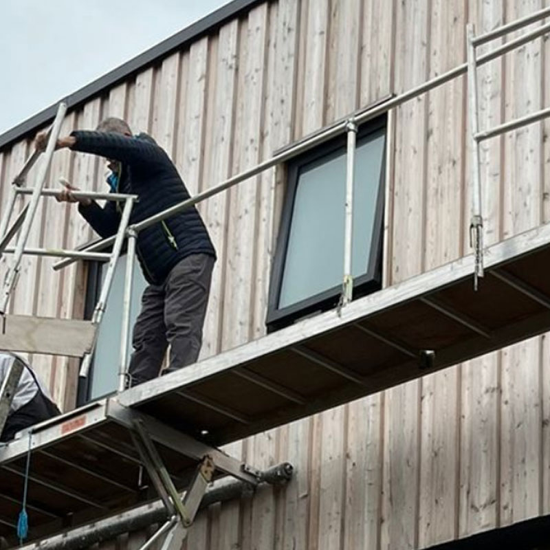 Woodstock Windows staff member installing windows in North Devon
