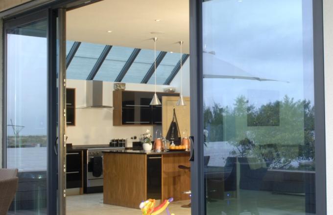 aluminium bi fold doors by a balcony