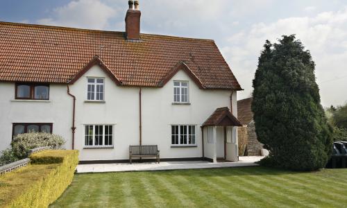 semi detached cottage with casement windows