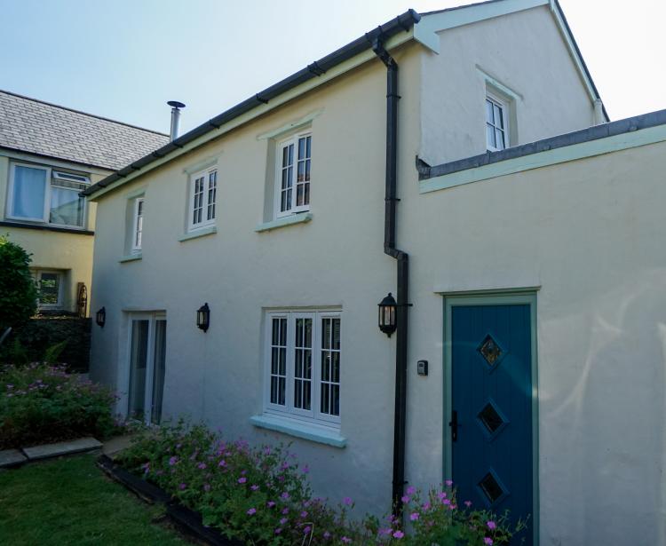 A Cottage with white windows 