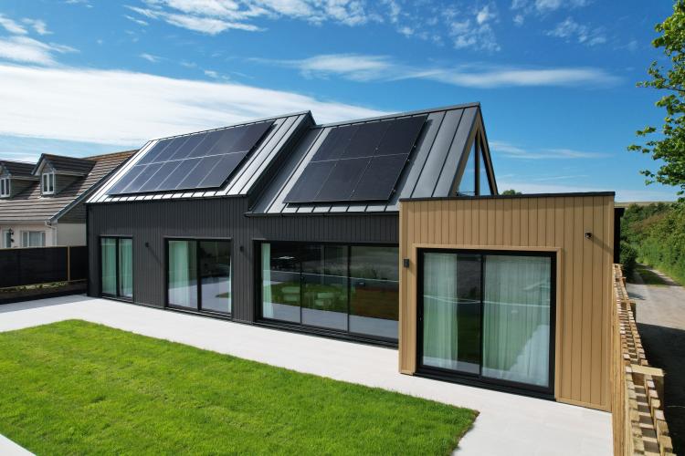 House with cladding, beautiful windows and sliding doors