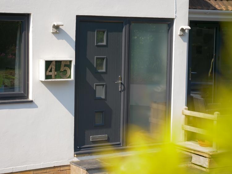 Grey coloured door fitted to a home