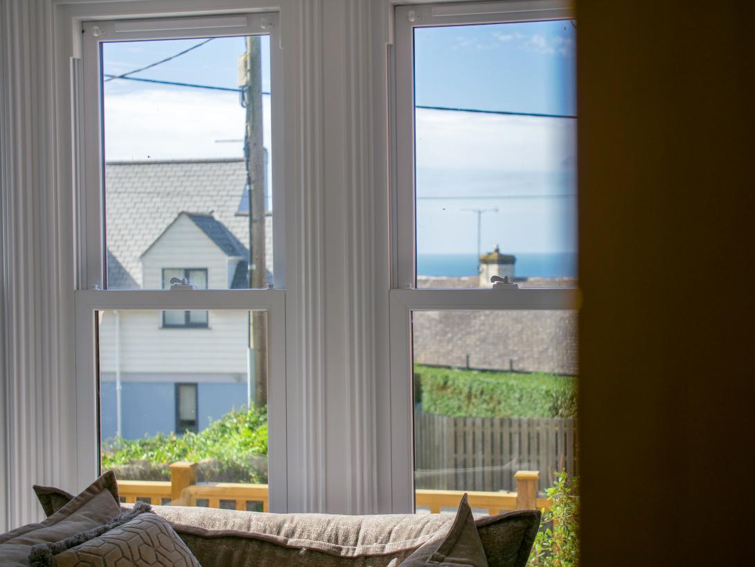 Legacy sliding sash windows looking out with sea views