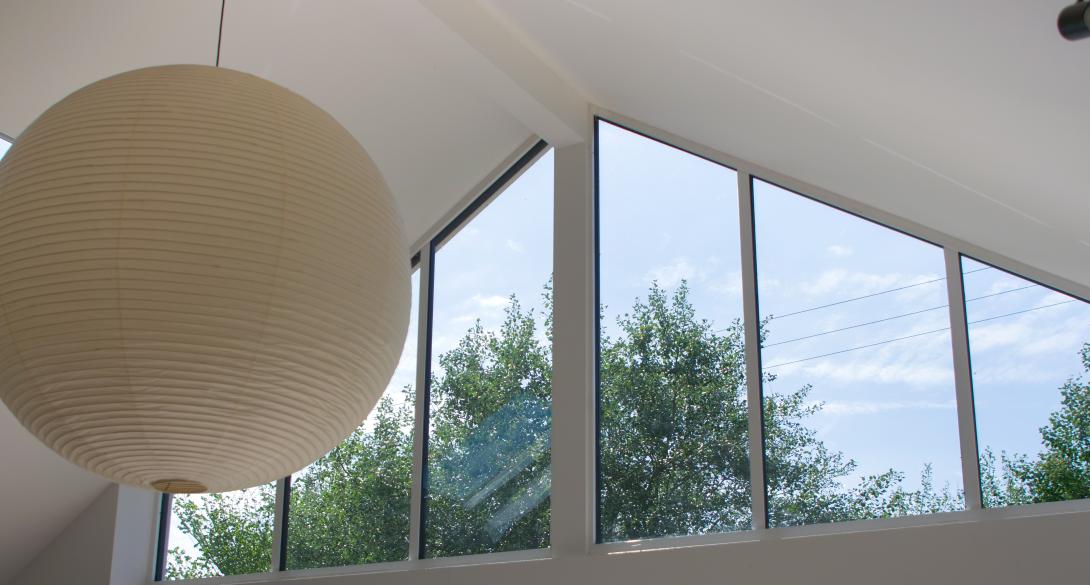 Top area of white framed patio door area