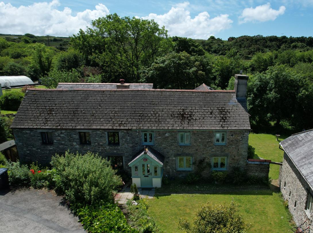 House with green coloured windows and door