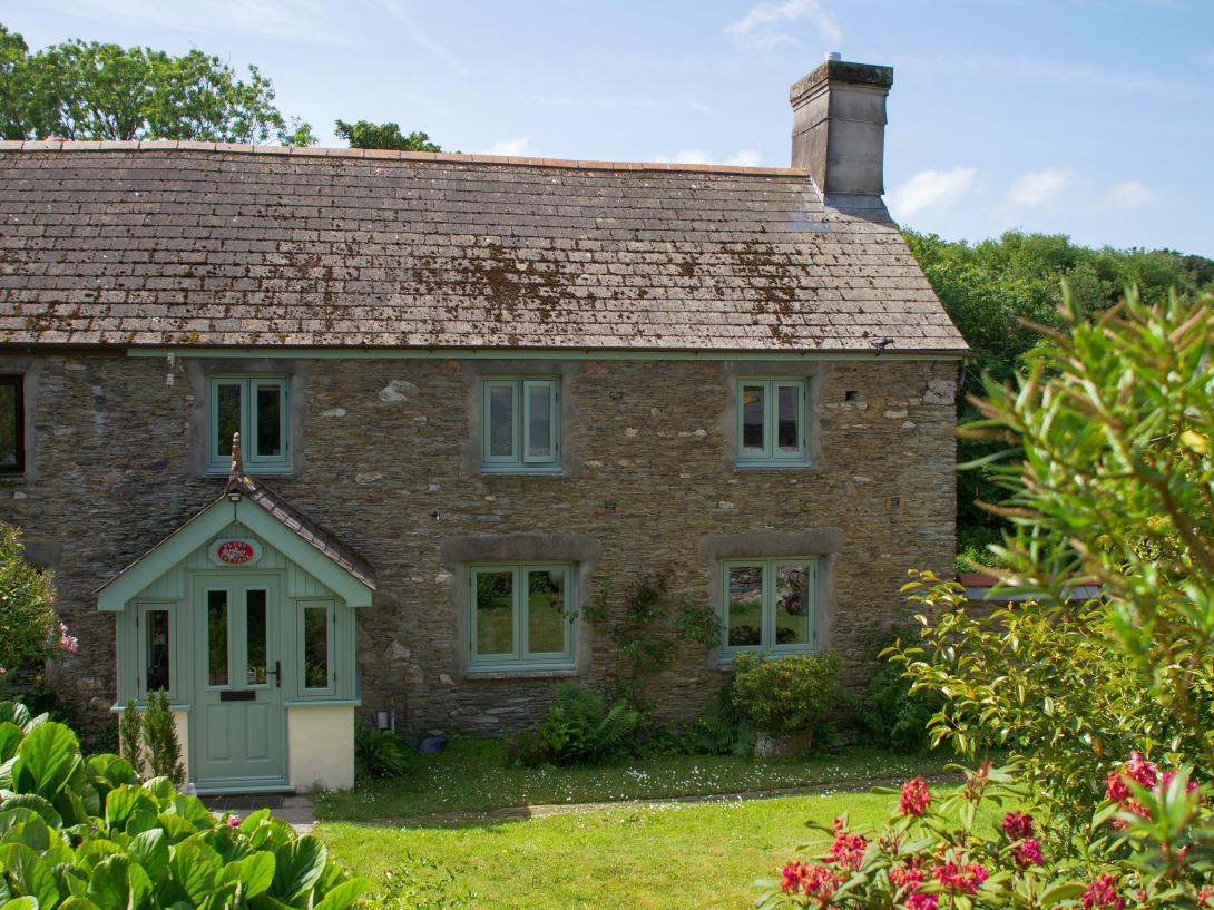 House with green coloured windows and door