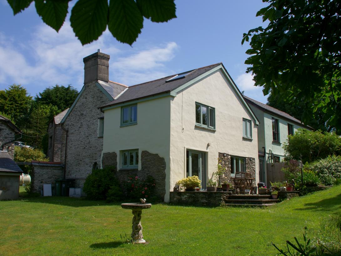 House garden area with green coloured windows and door