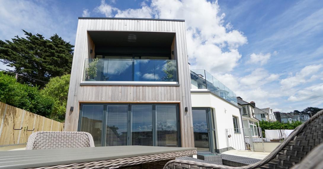 Outsidel image of house with newly fitted windows and sliding doors