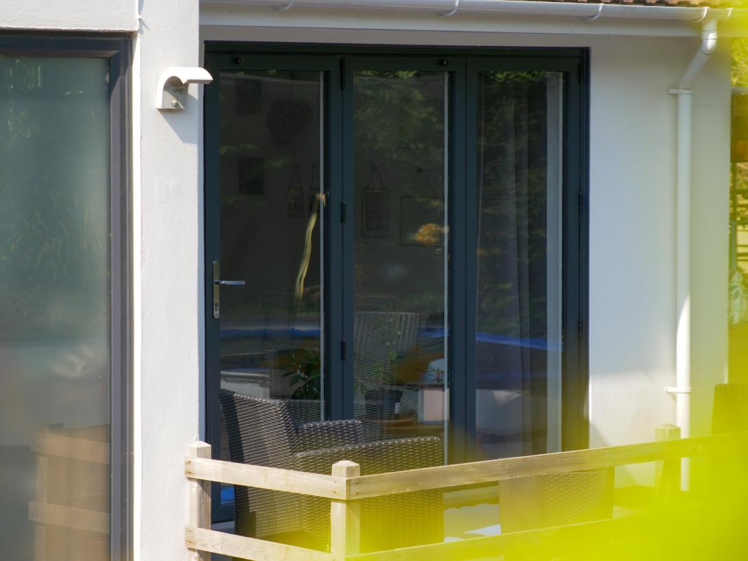 Grey coloured fitted patio doors by Woodstock Windows