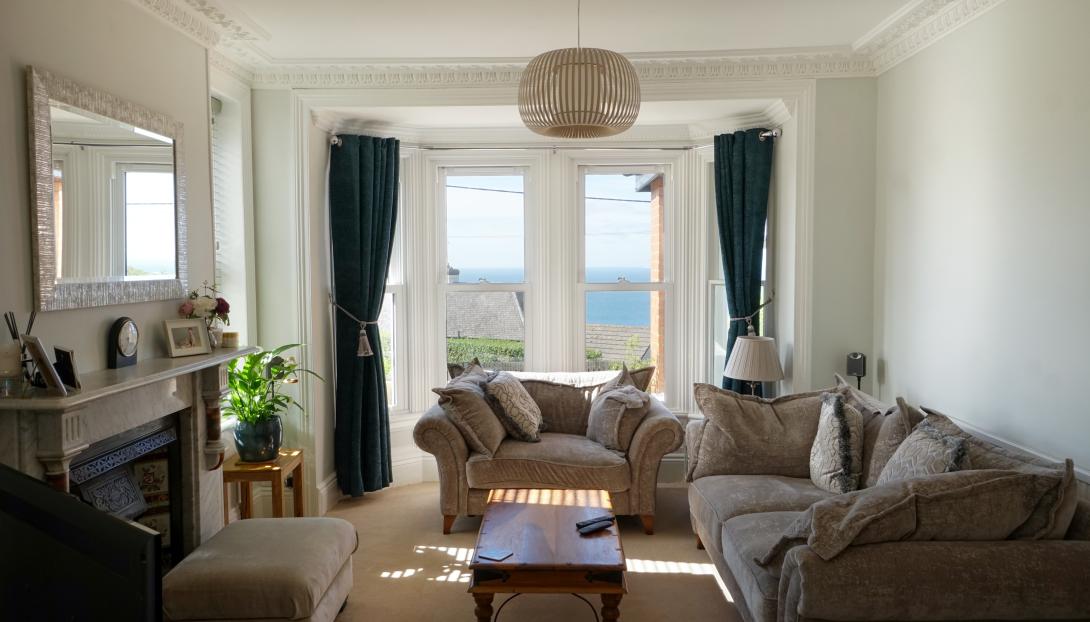 Interior view of A-rated uPVC sliding sash windows, including striking bay windows