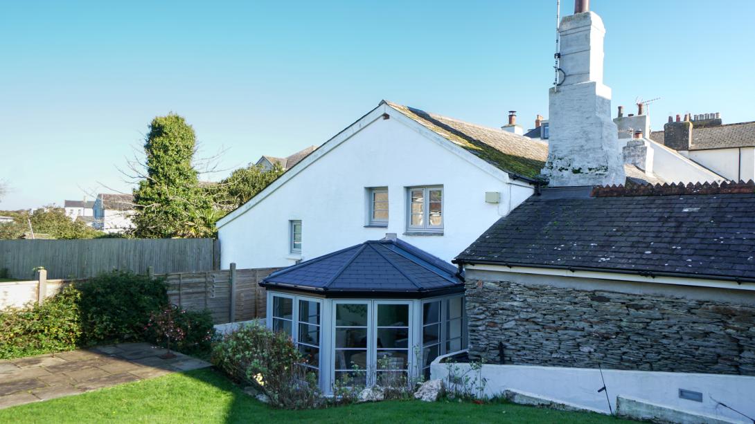 Residence windows with a conservatory featuring Residence 7 side frames and elegant French d