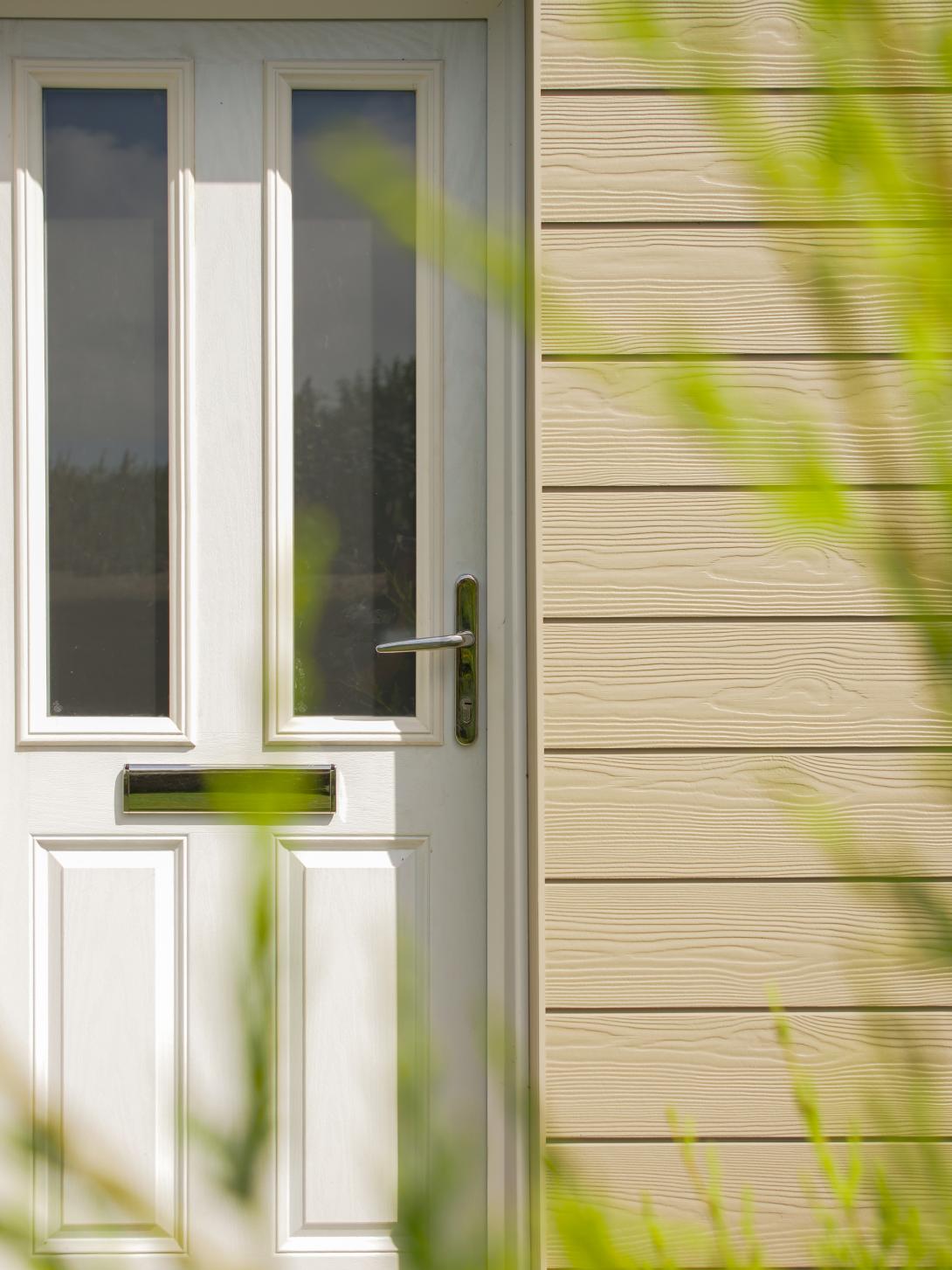 Solidor composite front door and cedral cladding